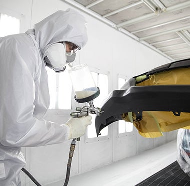 Collision Center Technician Painting a Vehicle | Westchester Toyota in Yonkers NY